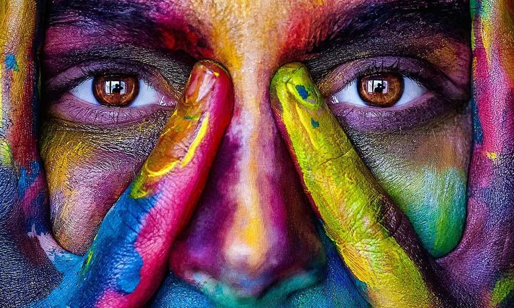 What precautions should be taken before playing Holi?