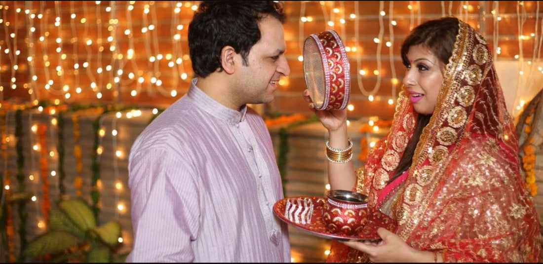 Husband wife performing karwa chauth rituals