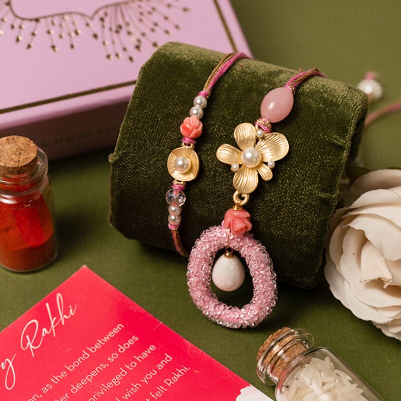 pink bhaiya bhabhi rakhi with flower and pearl decoration 
