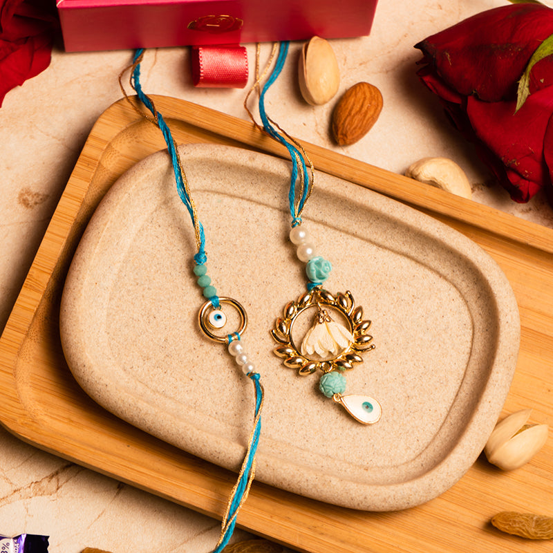 Delightful Evil Eye Bhaiya Bhabhi Rakhi Set