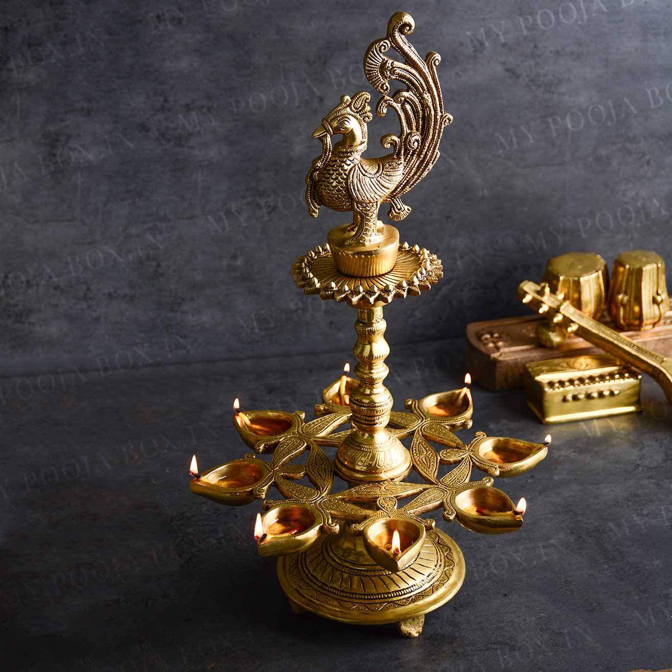 Alluring Brass Peacock Diya Stand