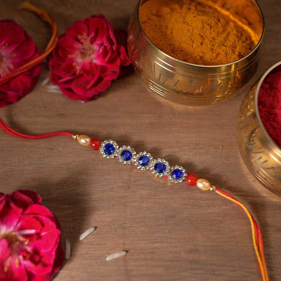 Buy Elegant Blue Diamond Rakhi Online in India - Mypoojabox.in