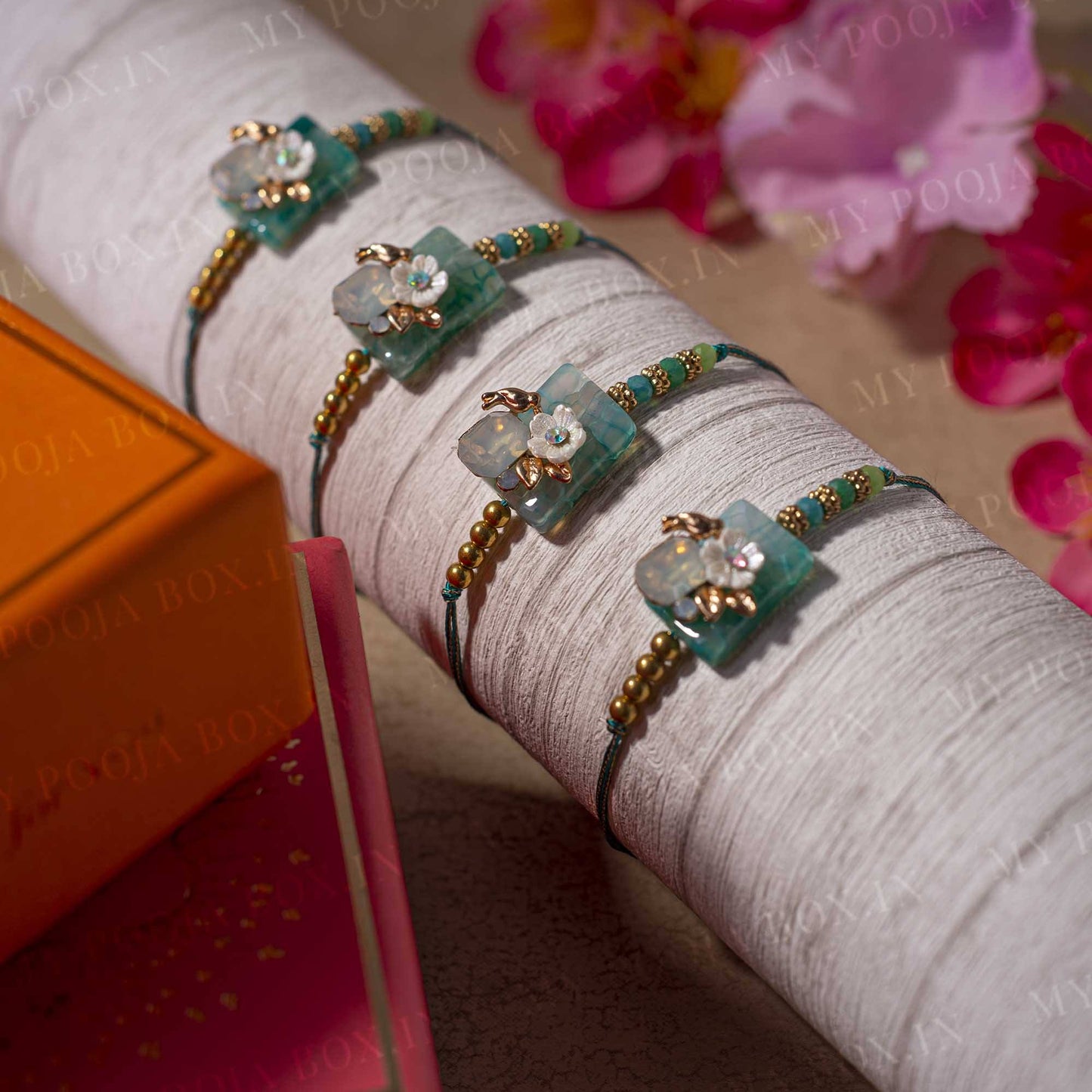 Teal Blue Floral Stone Rakhi (Set of 4)