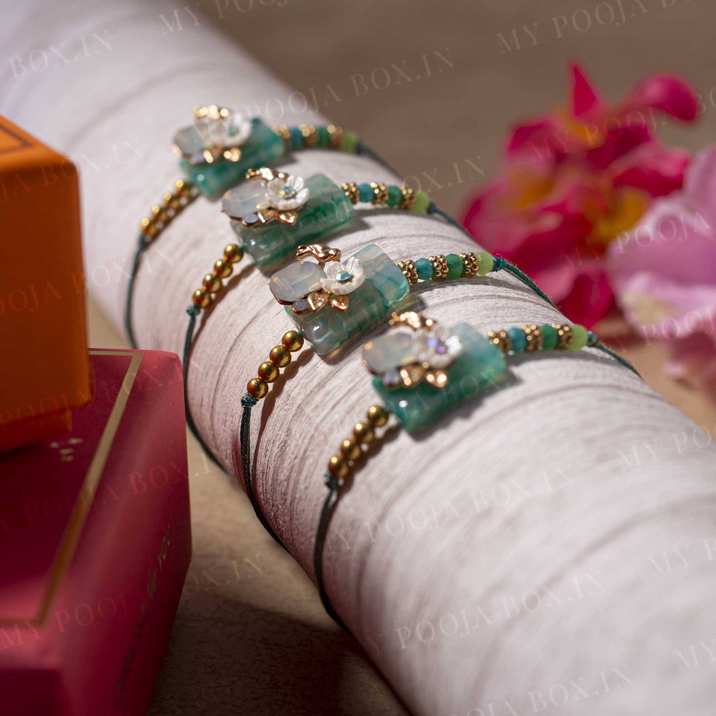 Teal Blue Floral Stone Rakhi (Set of 4)