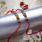 Elegant Gold & Green Beaded Rakhi (Set of 2)