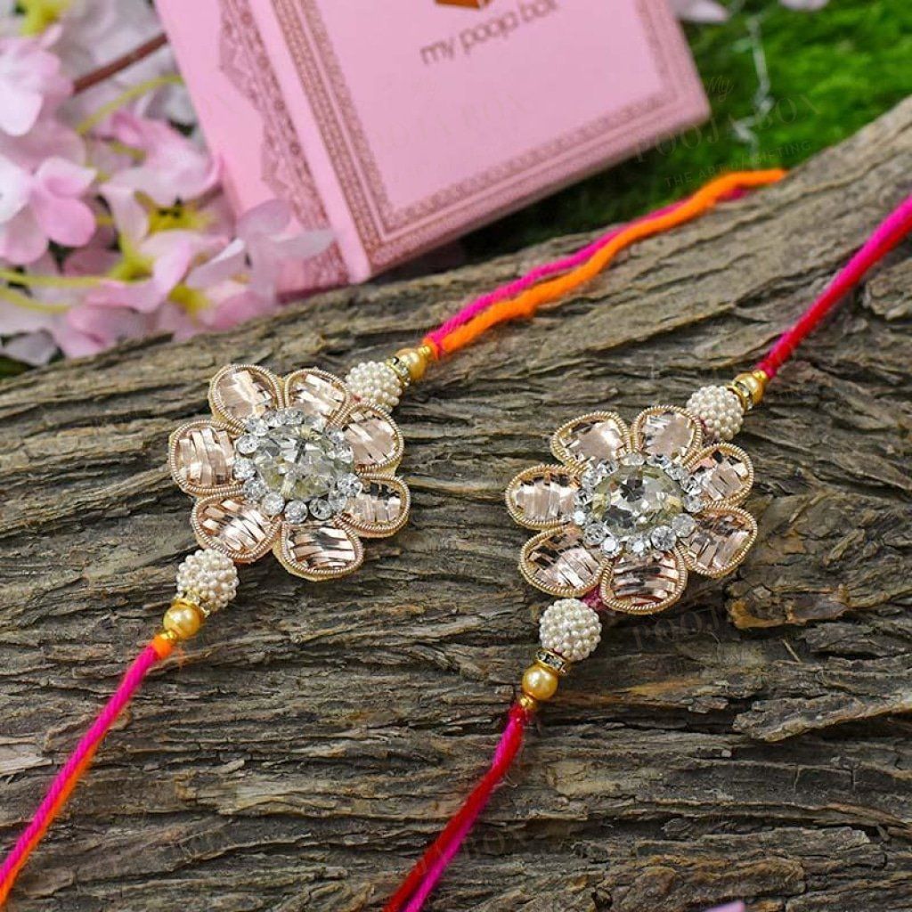 Elegant Zinnia Floral Rakhi Set Of 2